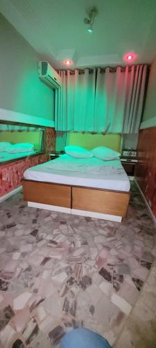 Postel nebo postele na pokoji v ubytování Hotel Centro Leste