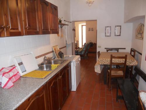 a kitchen with a sink and a counter top at Casale di montagna in Cansano