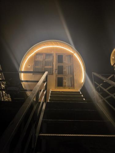 a stairway leading to a round building with lights at Gambhiraa Resorts in Kolli Hills