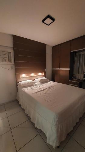 Ένα ή περισσότερα κρεβάτια σε δωμάτιο στο Apartamento na Praia da Ponta verde