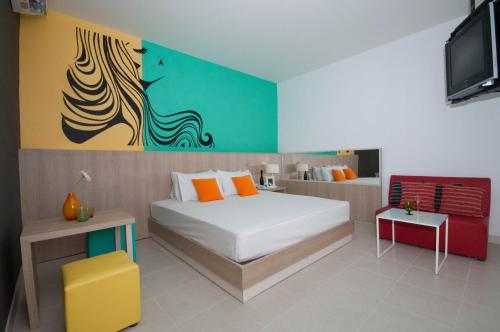 Ένα ή περισσότερα κρεβάτια σε δωμάτιο στο OK Resort Laemchabang