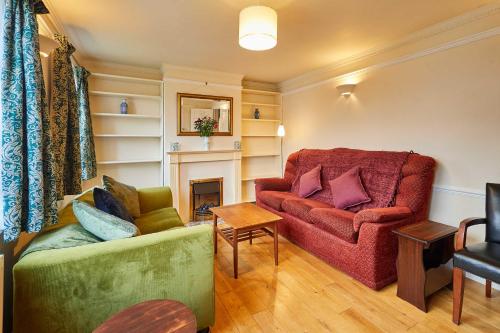 a living room with a couch and a chair at Host & Stay - Riders Rest in Wootton