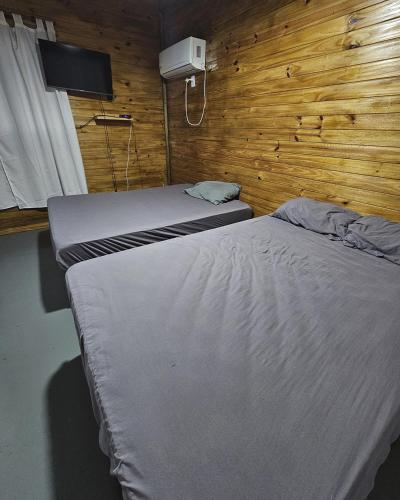 En eller flere senge i et værelse på Lagunas de la selva