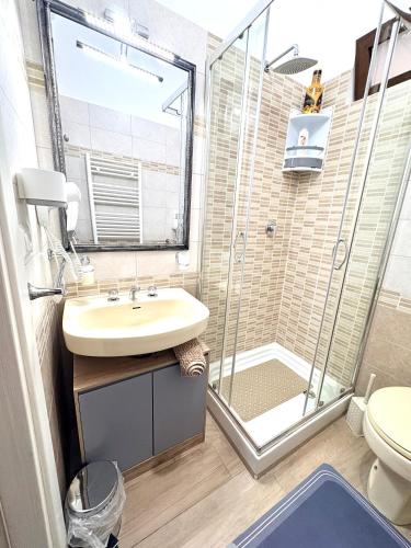 a bathroom with a sink and a shower at Stefy's House in Scalea