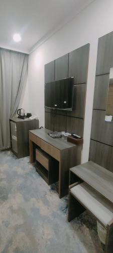 Televisyen dan/atau pusat hiburan di فندق دار المتكاملة 2