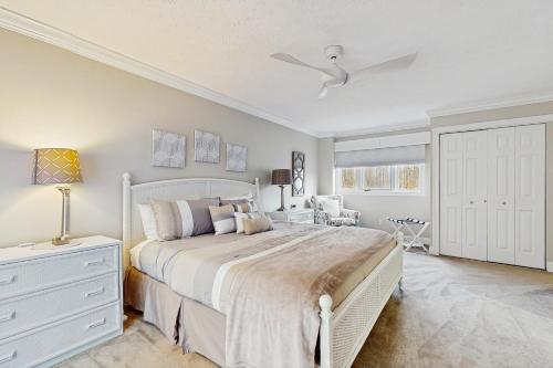 a bedroom with a white bed and a white dresser at Trout Creek Condo Resort: Condo 78 in Conway