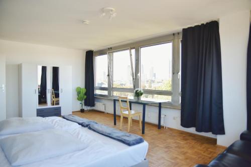 Postel nebo postele na pokoji v ubytování Sprachcaffe Appartements