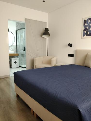 Una cama o camas en una habitación de Casa das Amendoeiras