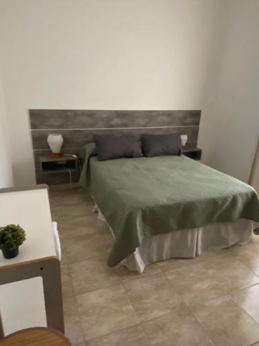 En eller flere senge i et værelse på Casa del Roble