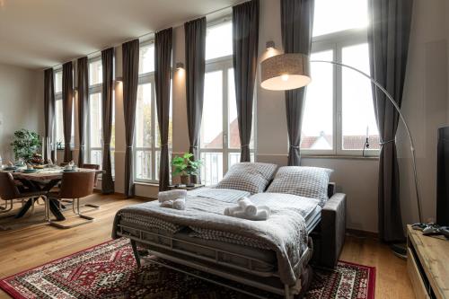 a bedroom with a bed with teddy bears on it at Loft - Zur alten Schule in Essingen in Essingen