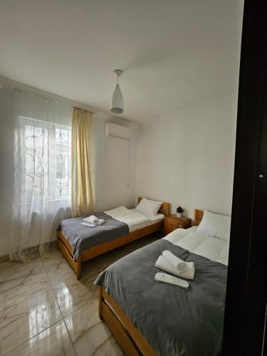 Postel nebo postele na pokoji v ubytování LSD Kobuleti