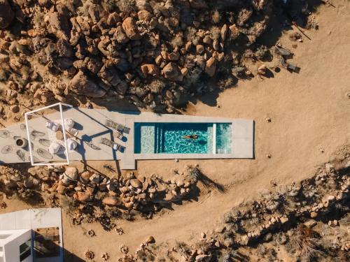 an overhead view of a swimming pool on a beach at Bolder House By The Cohost Company in Joshua Tree