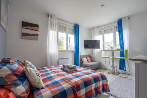 Кровать или кровати в номере Le petit loft