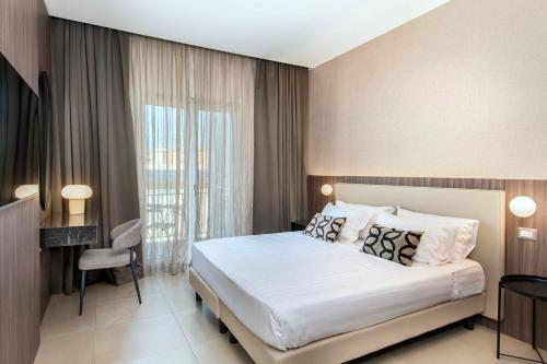 Ένα ή περισσότερα κρεβάτια σε δωμάτιο στο Hotel Europa