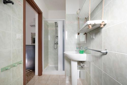 a bathroom with a sink and a shower at B&B Antiche Stelle Salento in Salve