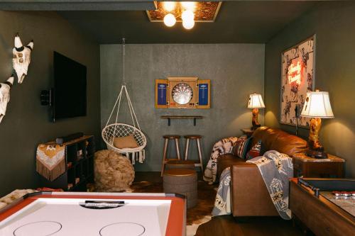 a living room with a pool table in the middle of it at Wild Moon Ranch Pickleball, Cedar Tub & Views in Julian