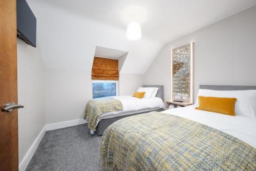 Ένα ή περισσότερα κρεβάτια σε δωμάτιο στο Glencairn by Escape Ordinary