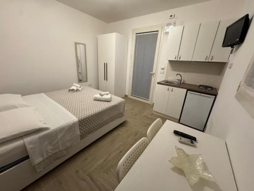 Postel nebo postele na pokoji v ubytování Agriturismo Masseria Pallanzano CON PISCINA