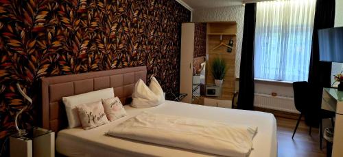 Postel nebo postele na pokoji v ubytování Hotel Schloßschenke