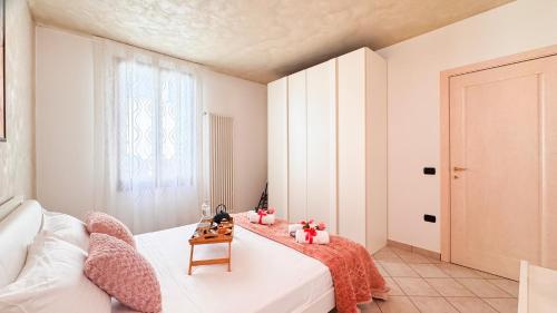 a bedroom with a white bed and a window at Lady Teresa 2-0 by Ca-Sa Check in Chioggia