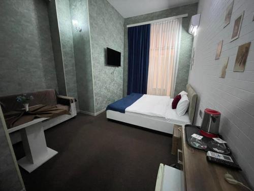 Ένα ή περισσότερα κρεβάτια σε δωμάτιο στο Best Center Nizami Hotel