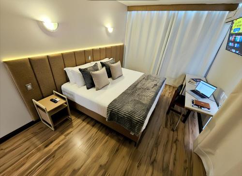 Postel nebo postele na pokoji v ubytování Hotel Santoni