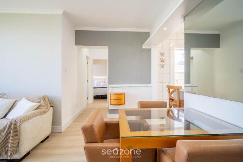 a living room with a couch and a glass table at Apt 2 Bedrooms w/ Air in Floripa CIS0033 in Florianópolis
