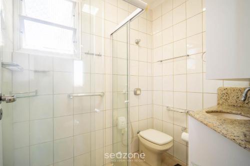 a bathroom with a shower and a toilet and a sink at Apt 2 Bedrooms w/ Air in Floripa CIS0033 in Florianópolis