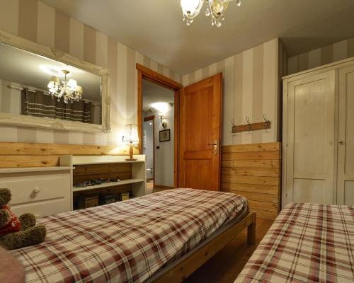 En eller flere senge i et værelse på Courmaison - Appartamento di charme