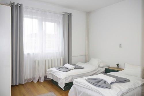 Postel nebo postele na pokoji v ubytování Szent Ferenc Vendégház