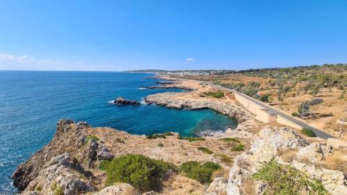 an aerial view of the ocean and a road at Salento - Casa Vacanza di appartamento open space in Nardò