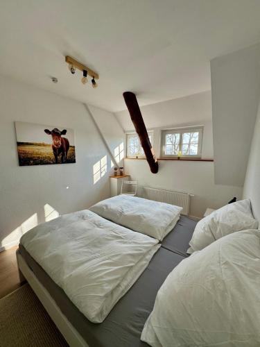 Postel nebo postele na pokoji v ubytování Seelöwe beim Ochsenturm am Deich