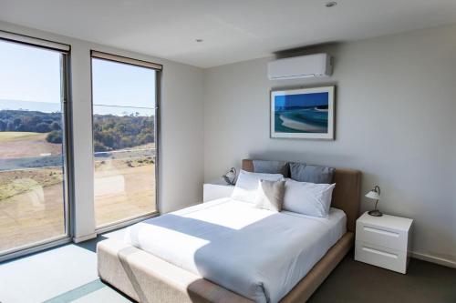 Ένα ή περισσότερα κρεβάτια σε δωμάτιο στο St Andrews Golf Course and Nature Getaway