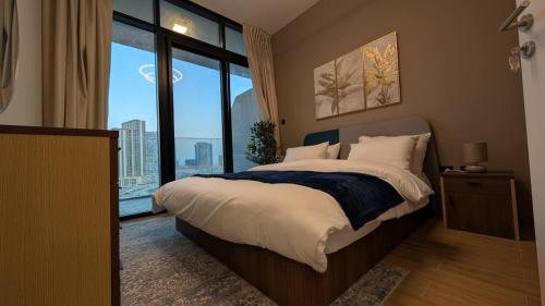 Ένα ή περισσότερα κρεβάτια σε δωμάτιο στο Stylish 1BR on Maryah Island Walk to Cleveland