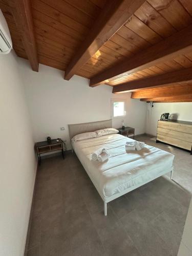 Postel nebo postele na pokoji v ubytování Casa nel verde a fontane bianche