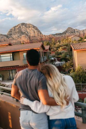 a man and a woman looking at a mountain at The Wilde Resort and Spa in Sedona