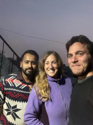 three men and a woman posing for a picture at Agam Homestay-Two Minutes Walk From Golden Temple in Amritsar