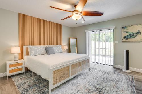 a bedroom with a bed and a ceiling fan at Modern Coastal Escape 1 Mi to Anclote River Park in Anclote