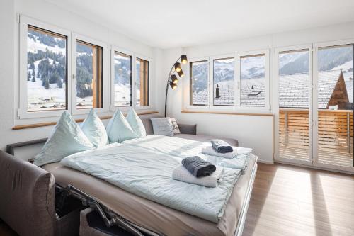 Postel nebo postele na pokoji v ubytování Chuenislodge1 Neu, grosse Terrasse & Designerofen, prächtige Aussicht