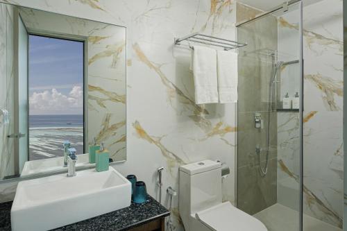 a bathroom with a sink and a shower and a mirror at h78 Guraidhoo in Guraidhoo
