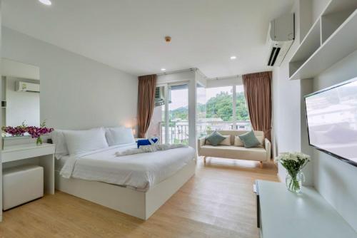 Postel nebo postele na pokoji v ubytování Ozone Condotel by RESAVA