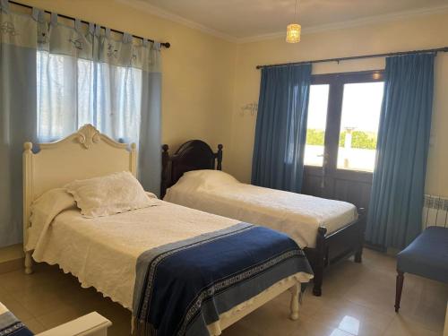 En eller flere senge i et værelse på Yunga Sanlorenceña