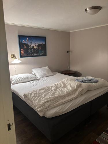 Postel nebo postele na pokoji v ubytování Strand huset