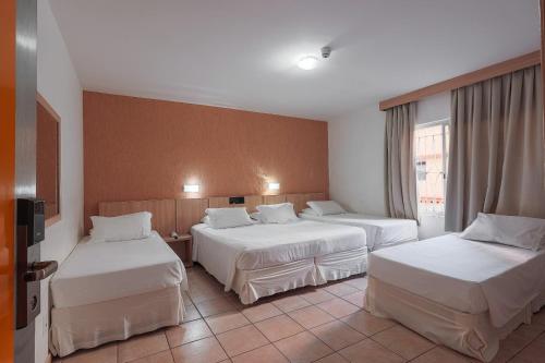 Postel nebo postele na pokoji v ubytování Hotel Açores