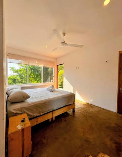 Ένα ή περισσότερα κρεβάτια σε δωμάτιο στο Casa Tepoztli