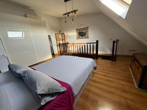 a bedroom with a large bed in a attic at Cozy Apartment Madrid in Madrid