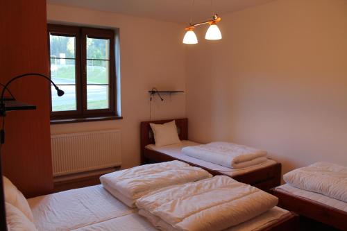 Posteľ alebo postele v izbe v ubytovaní Apartmány Olympia