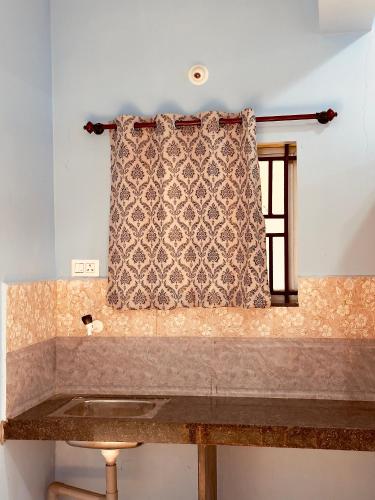 a sink in a room with a window at Barefoot and Beyond - Crafted with Kenchas in Gokarna