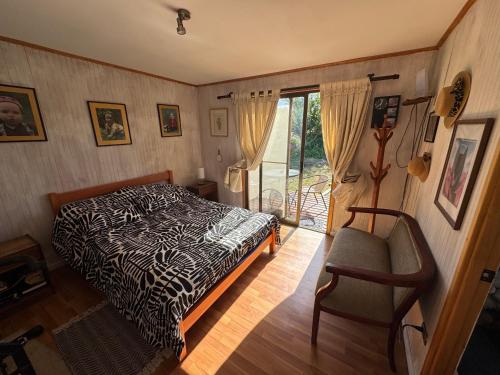 Ένα ή περισσότερα κρεβάτια σε δωμάτιο στο Casa Familiar Santo Domingo