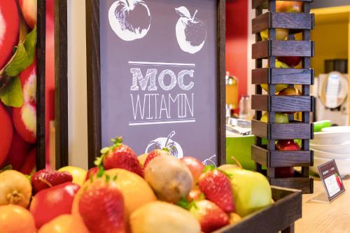 a display of apples and strawberries in a store at Ibis Warszawa Ostrobramska in Warsaw